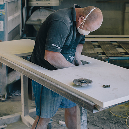 Photograph of man working in workshop